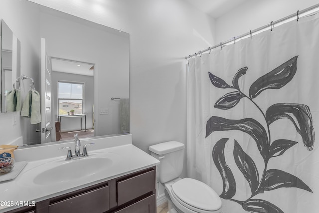 12370 W Cassia Trl, Peoria, AZ 85383 - full bathroom with vanity, toilet, and a shower with shower curtain