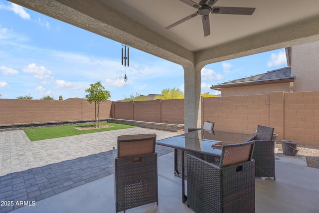 12370 W Cassia Trl, Peoria, AZ 85383 - fenced backyard featuring ceiling fan, a patio area, and outdoor dining space