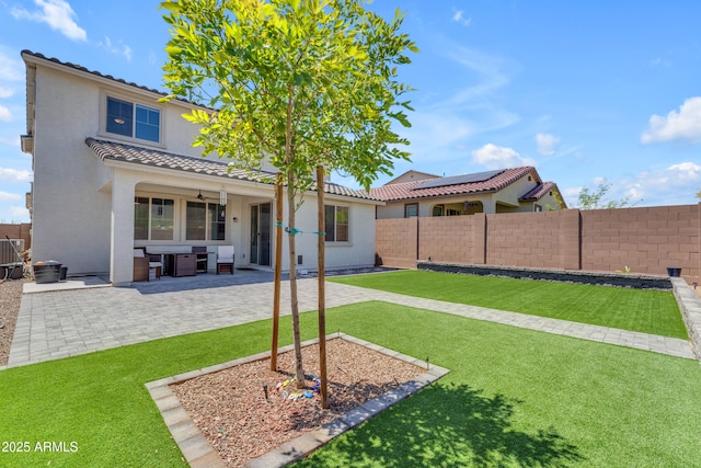 12370 W Cassia Trl, Peoria, AZ 85383 - rear view of house featuring a tile roof, stucco siding, and a patio