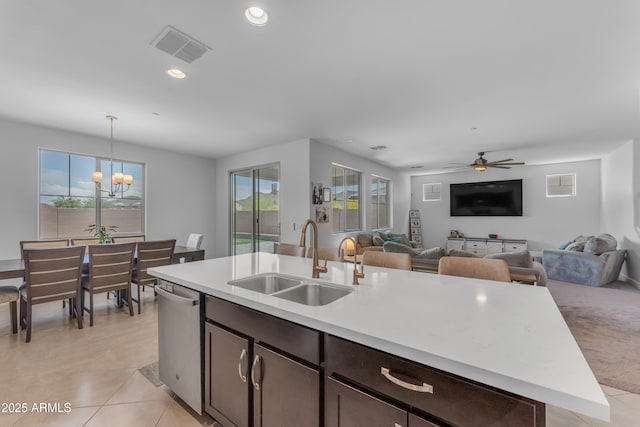 12370 W Cassia Trl, Peoria, AZ 85383 - kitchen with a sink, dishwasher, light countertops, open floor plan, and recessed lighting