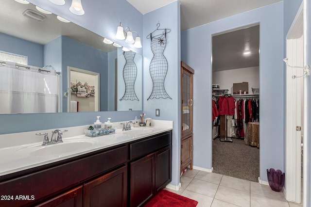 bathroom with tile patterned flooring, vanity, and a shower with shower curtain