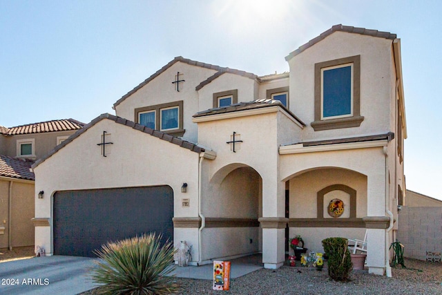 mediterranean / spanish-style house featuring a garage