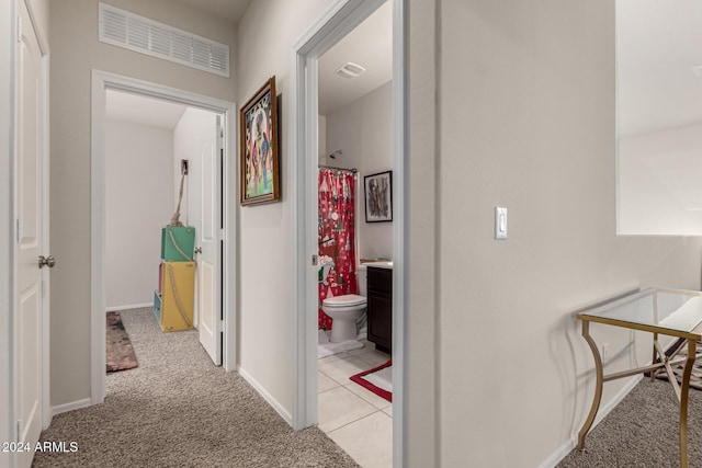 corridor with light colored carpet