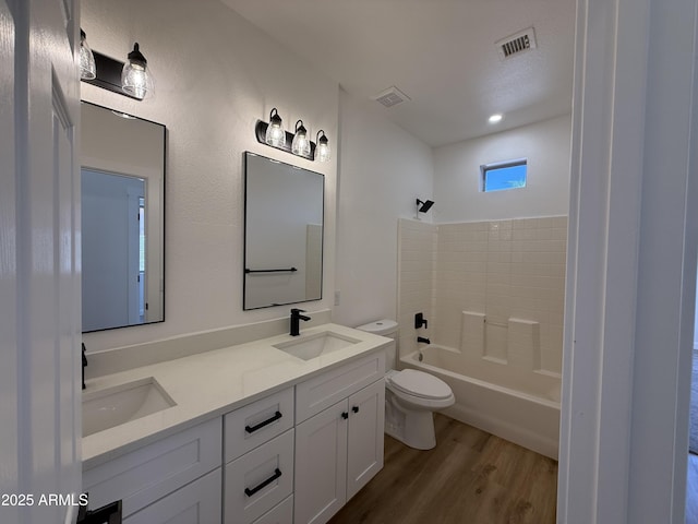 81 E Smoke Tree Rd, Gilbert, AZ 85296 - bathroom featuring wood finished floors, double vanity, and bathtub / shower combination