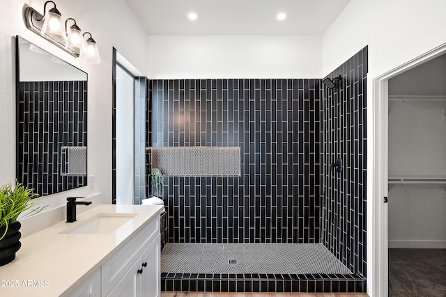 81 E Smoke Tree Rd, Gilbert, AZ 85296 - full bathroom featuring vanity, a tile shower, a spacious closet, and recessed lighting