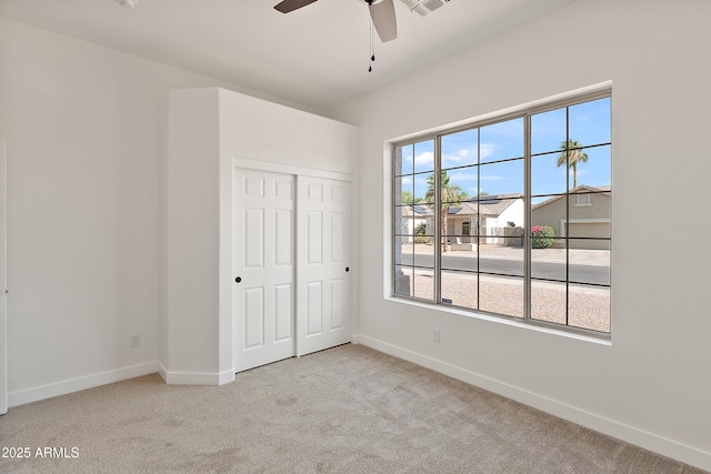 81 E Smoke Tree Rd, Gilbert, AZ 85296 - unfurnished bedroom with carpet floors, a closet, and ceiling fan