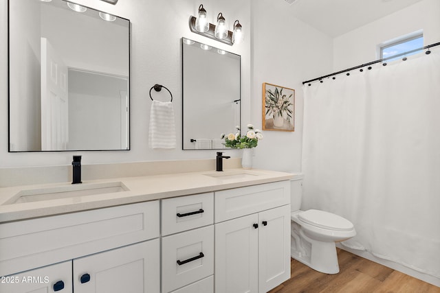 81 E Smoke Tree Rd, Gilbert, AZ 85296 - bathroom featuring double vanity, wood finished floors, and curtained shower