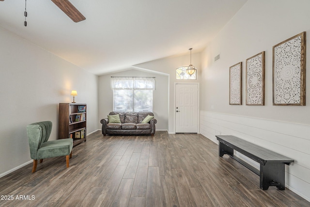 sitting room with dark hardwood / wood-style flooring, ceiling fan, and lofted ceiling