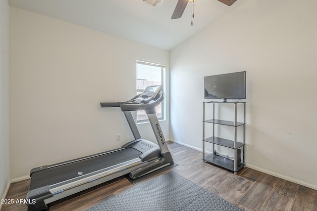 exercise area with vaulted ceiling, ceiling fan, and dark hardwood / wood-style floors