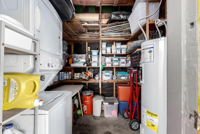 storage area with water heater and stacked washing maching and dryer