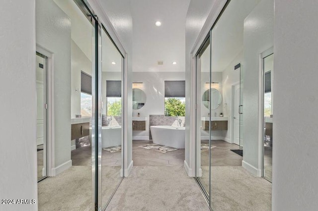 6449 E Paradise Ln, Scottsdale, AZ 85254 - bathroom featuring a freestanding bath, recessed lighting, and baseboards