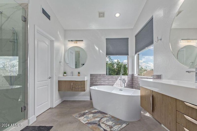 6449 E Paradise Ln, Scottsdale, AZ 85254 - bathroom with a shower stall, a freestanding bath, and two vanities
