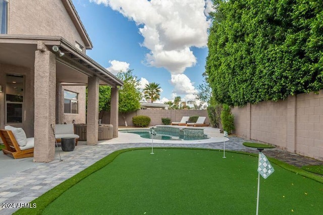 6449 E Paradise Ln, Scottsdale, AZ 85254 - fenced backyard with a putting green, a patio, and a hot tub