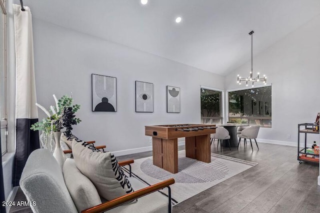 6449 E Paradise Ln, Scottsdale, AZ 85254 - recreation room with baseboards, lofted ceiling, a chandelier, wood finished floors, and recessed lighting