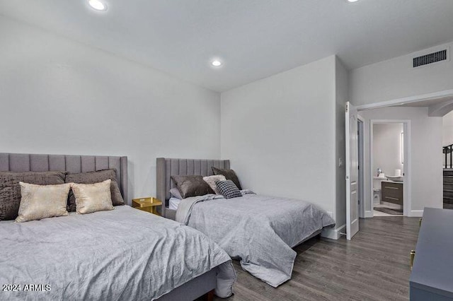 6449 E Paradise Ln, Scottsdale, AZ 85254 - bedroom featuring dark wood-style floors, recessed lighting, and baseboards