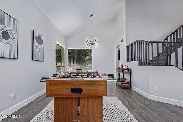 6449 E Paradise Ln, Scottsdale, AZ 85254 - playroom featuring dark wood-style floors, a chandelier, baseboards, and vaulted ceiling