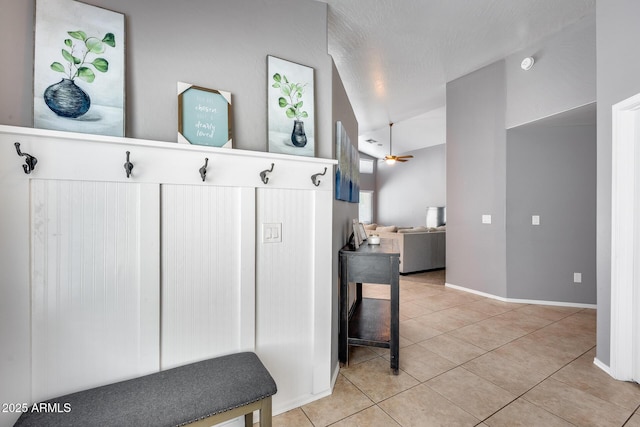7435 W Trails Dr, Glendale, AZ 85308 - mudroom with light tile patterned floors, ceiling fan, and lofted ceiling