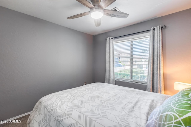7435 W Trails Dr, Glendale, AZ 85308 - carpeted bedroom with baseboards and a ceiling fan