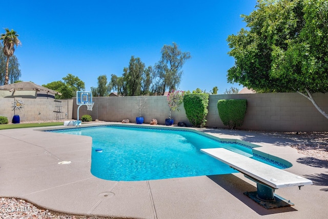 7435 W Trails Dr, Glendale, AZ 85308 - view of pool featuring a diving board, a fenced backyard, and a patio