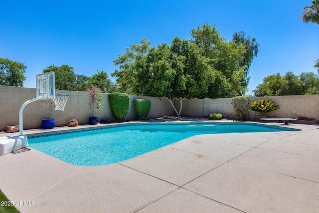 7435 W Trails Dr, Glendale, AZ 85308 - view of swimming pool with a fenced backyard, a patio area, and a diving board