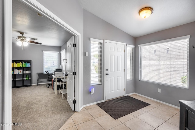 7435 W Trails Dr, Glendale, AZ 85308 - entrance foyer with lofted ceiling, light tile patterned flooring, and a ceiling fan