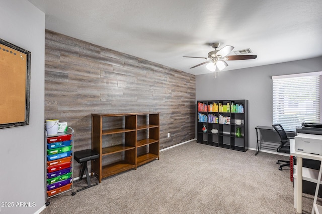 7435 W Trails Dr, Glendale, AZ 85308 - office space with ceiling fan, wood walls, carpet floors, and an accent wall