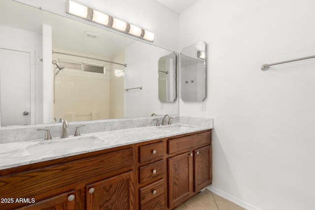 bathroom with vanity, a shower, and tile patterned floors