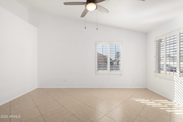 unfurnished room with light tile patterned flooring, ceiling fan, vaulted ceiling, and a wealth of natural light