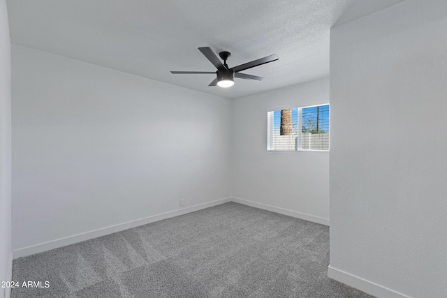 unfurnished room with carpet flooring and ceiling fan