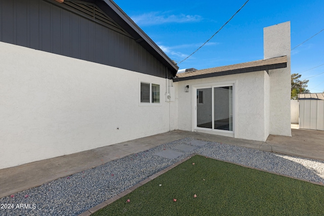 back of property featuring a patio area