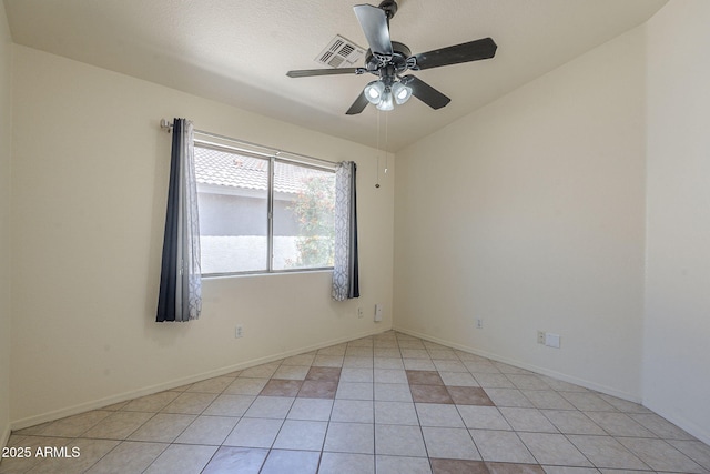 8660 E Nido Ave, Mesa, AZ 85209 - spare room featuring ceiling fan, vaulted ceiling, and light tile patterned floors