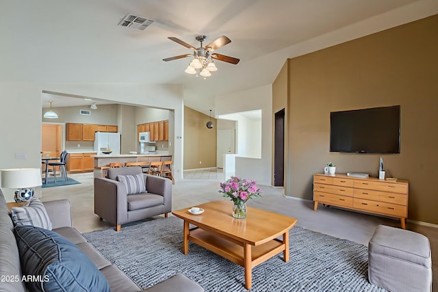 8660 E Nido Ave, Mesa, AZ 85209 - living area with lofted ceiling, a ceiling fan, and light colored carpet