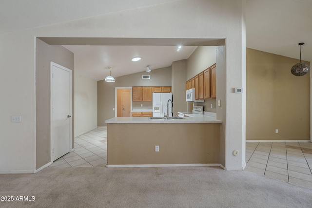 8660 E Nido Ave, Mesa, AZ 85209 - kitchen featuring white appliances, light tile patterned floors, vaulted ceiling, light countertops, and brown cabinets