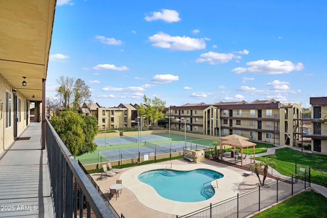 pool featuring a patio area and fence