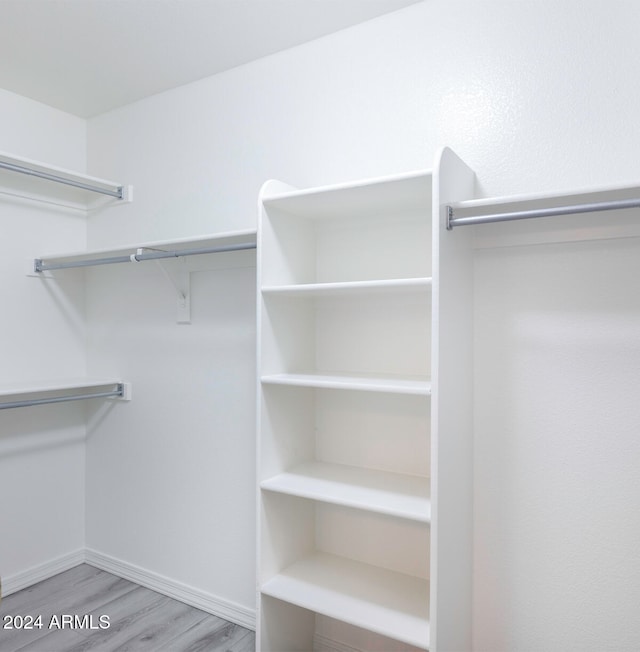 spacious closet featuring light wood-type flooring