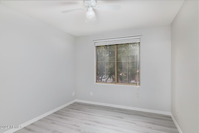 empty room featuring ceiling fan and light wood-type flooring