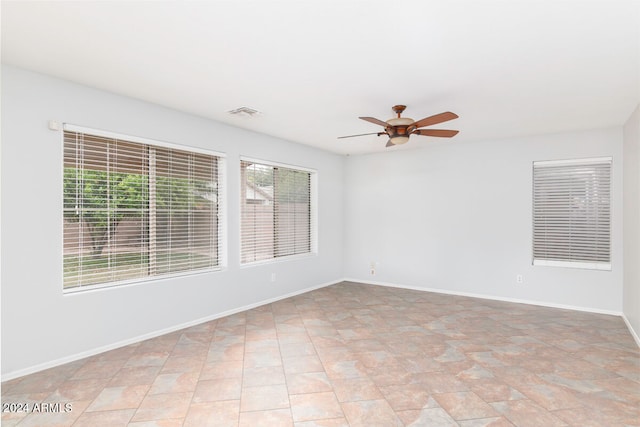 unfurnished room featuring ceiling fan