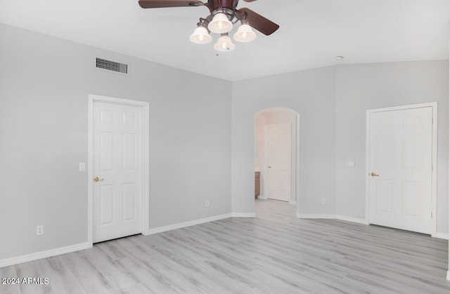 unfurnished room with light hardwood / wood-style flooring, ceiling fan, and lofted ceiling