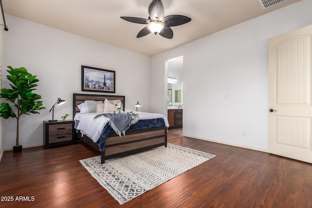 bedroom with visible vents, baseboards, dark wood finished floors, ensuite bath, and ceiling fan