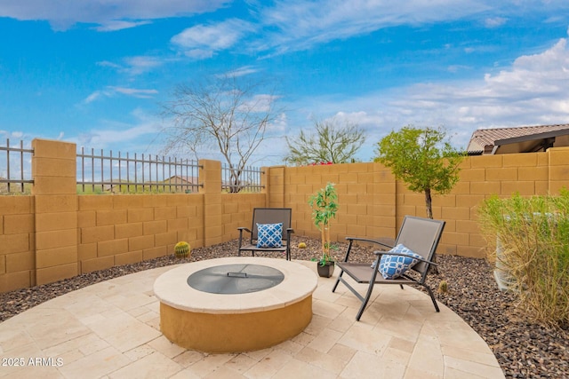 view of patio / terrace featuring a fenced backyard and an outdoor fire pit