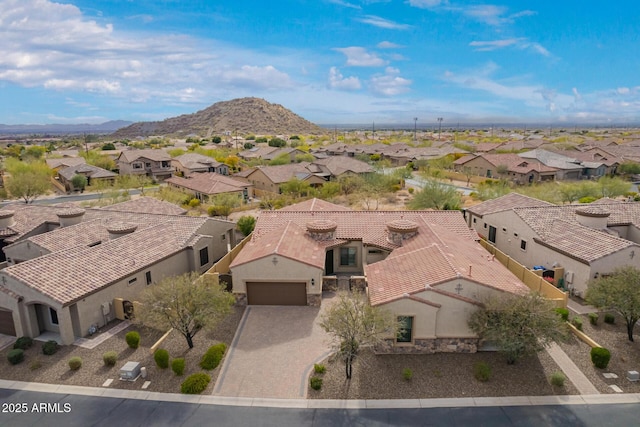 drone / aerial view featuring a mountain view and a residential view