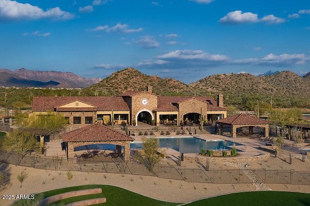 view of swimming pool with a fenced in pool, fence, a gazebo, a patio area, and a mountain view