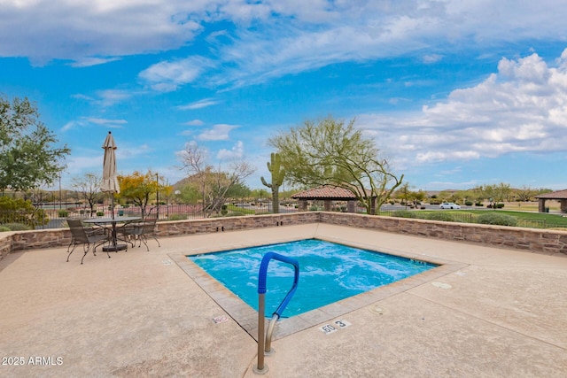 view of pool with outdoor dining space and a patio area