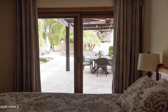 bedroom featuring multiple windows and access to exterior