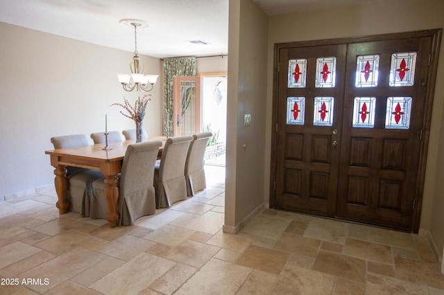 entrance foyer featuring an inviting chandelier