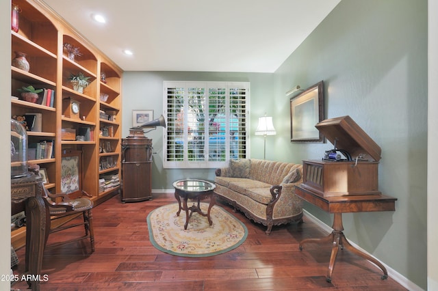 sitting room with hardwood / wood-style flooring