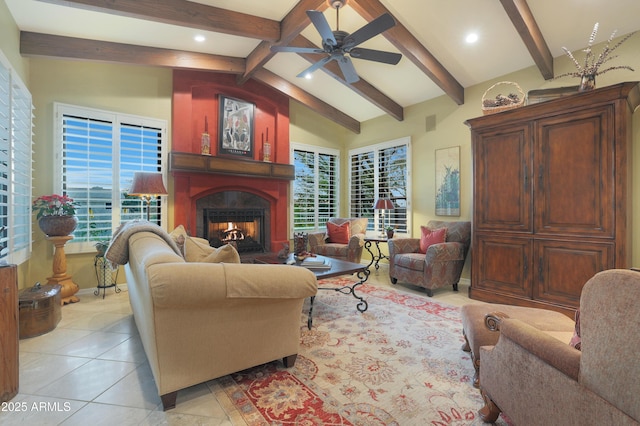 living room with lofted ceiling with beams, ceiling fan, and light tile patterned floors