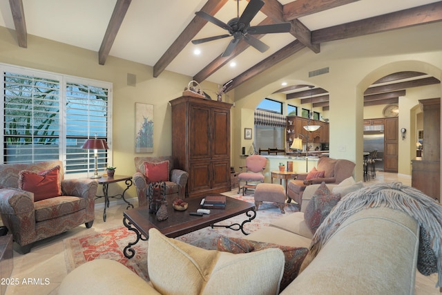 living room with lofted ceiling with beams, ceiling fan, and light tile patterned flooring