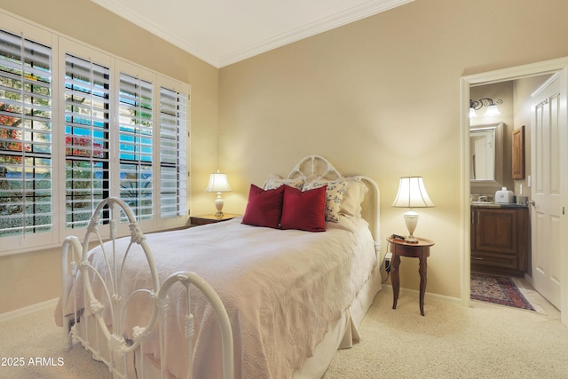 carpeted bedroom featuring connected bathroom and ornamental molding