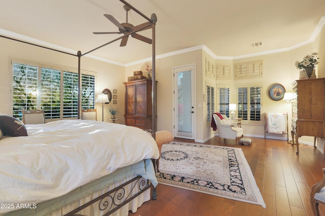 bedroom with ceiling fan, ornamental molding, and hardwood / wood-style flooring